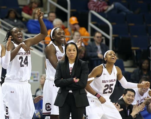 The steely stare of South Carolina's Dawn Staley with Aleighsa Welch, Alaina  Coates, and Tiffany Mitchell's joy. Hey, you're a #1 seed...lighten up!