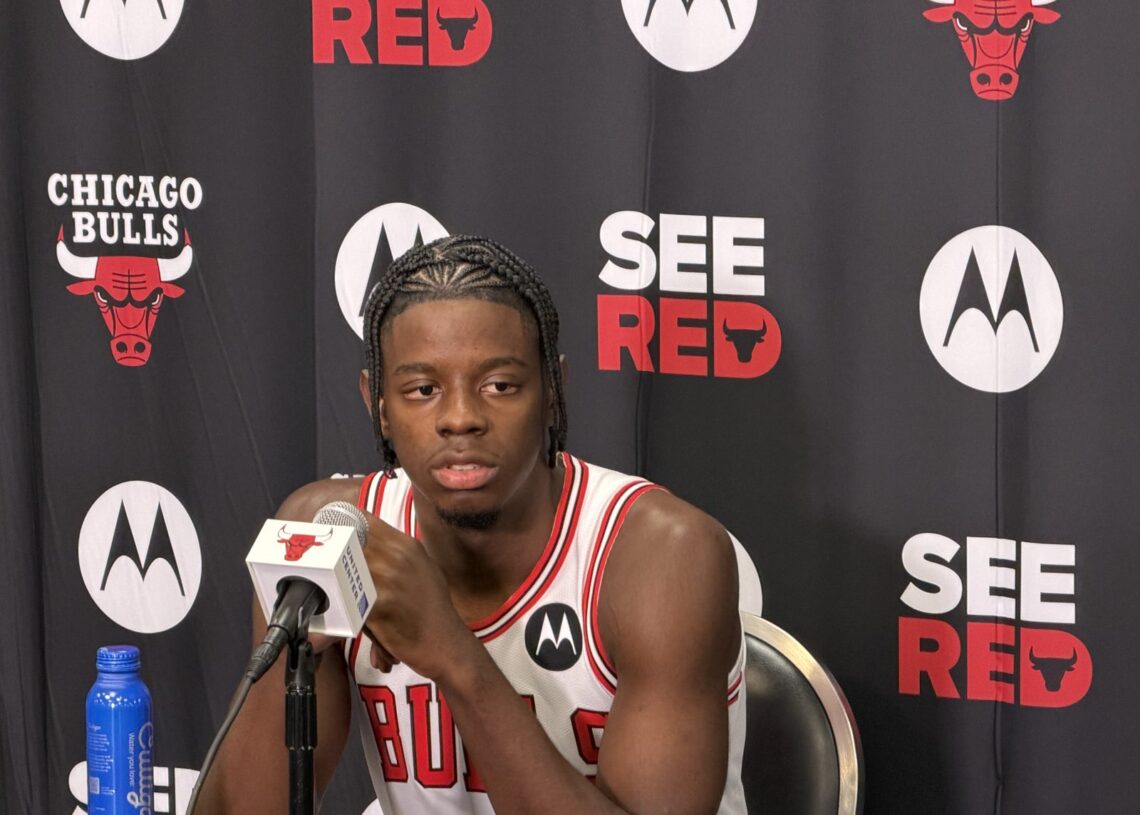 Chicago Bulls rookie Caleb Wilson answers questions at the podium during media day