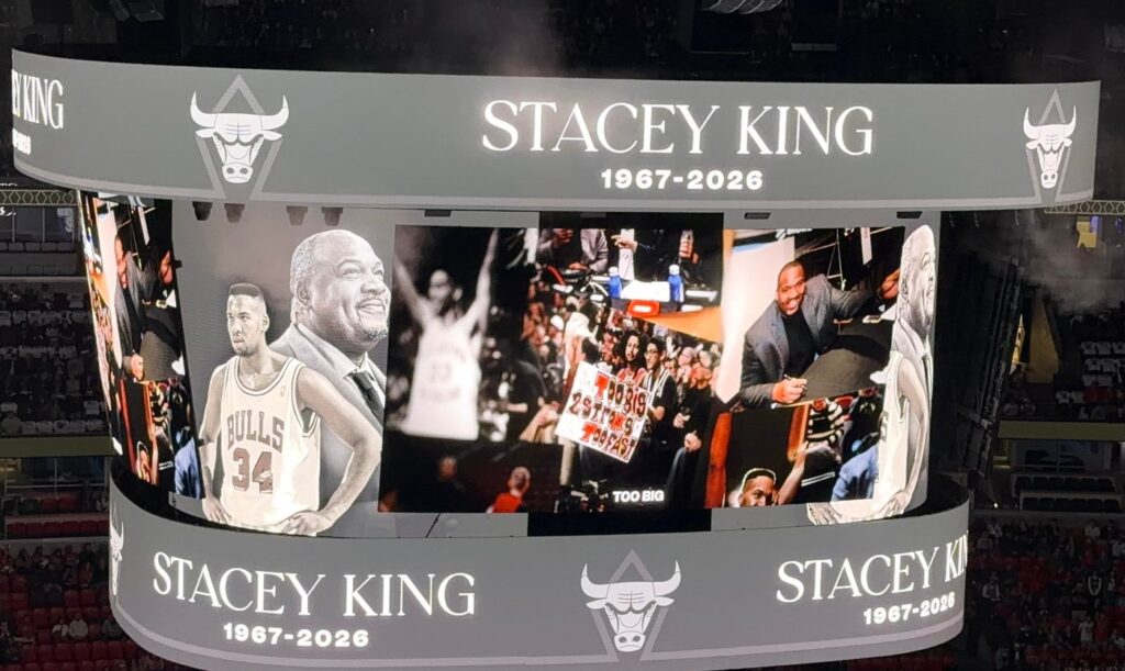 Stacey King tribute collage on the United Center scoreboard with photos from his playing and broadcasting career